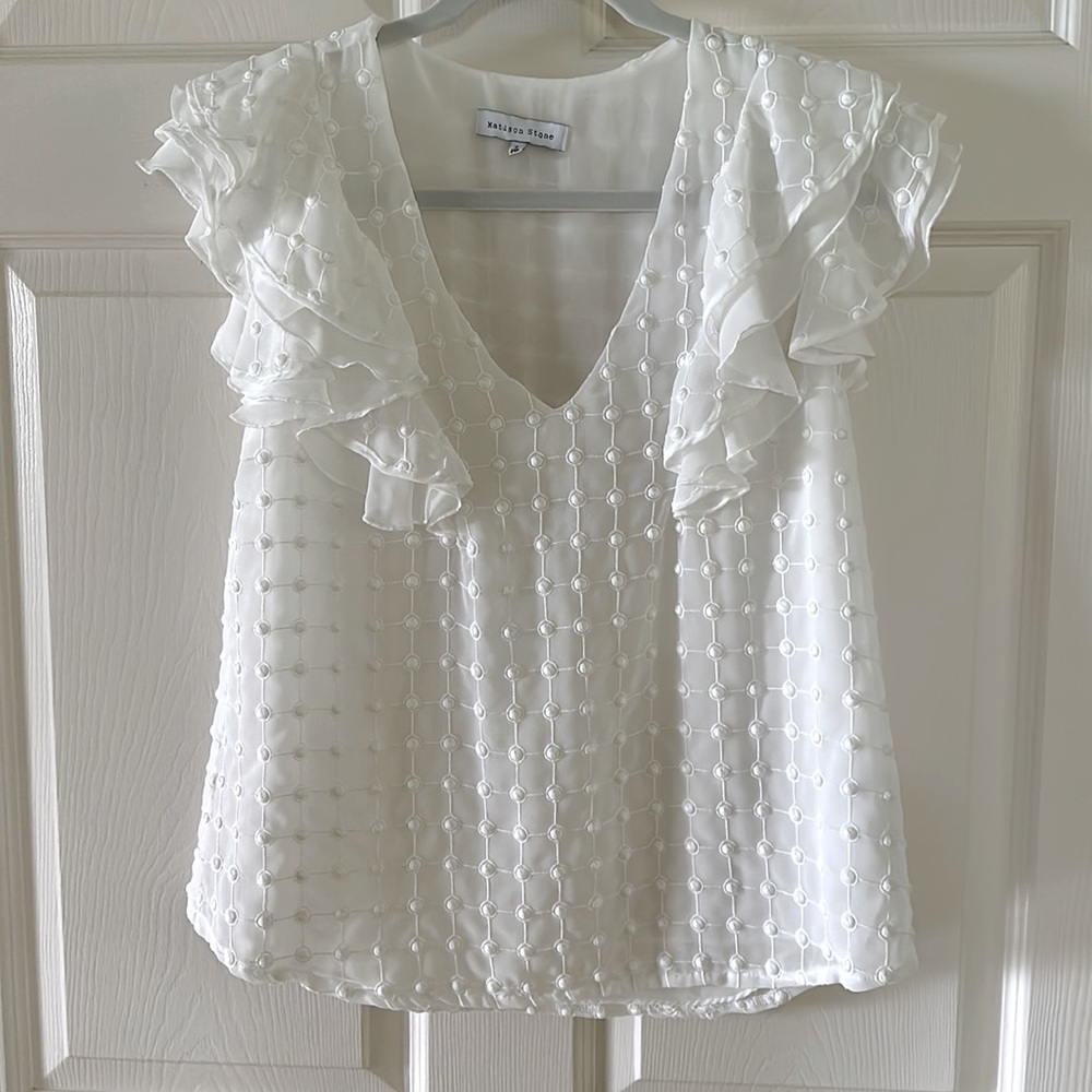 Matison Stone from Anthropologie white blouse with ruffle sleeves